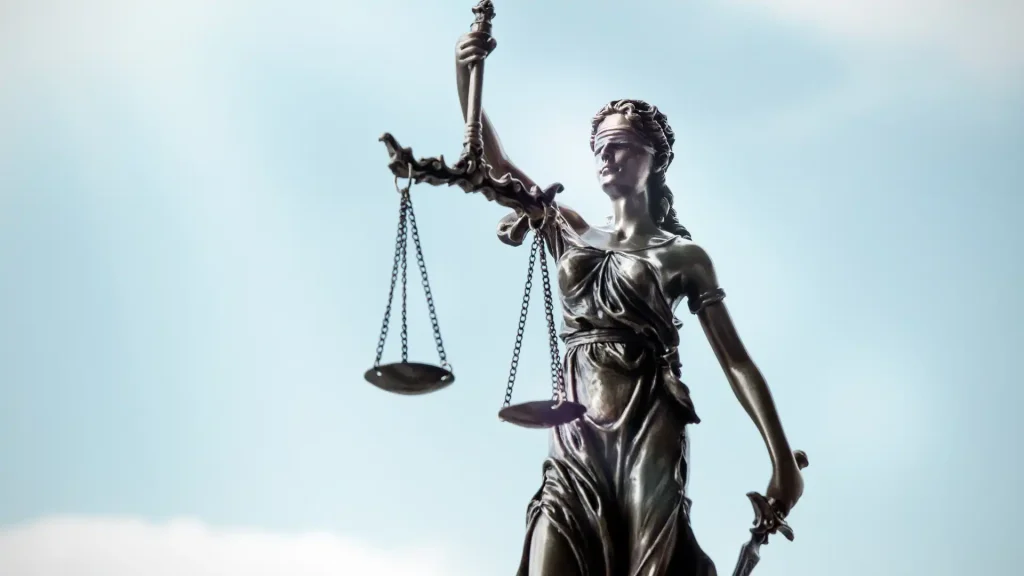 Statue of Lady Justice holding scales and a sword